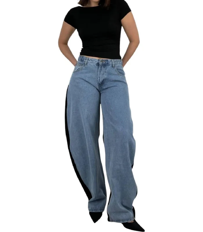 Trend Forward Women's Wear Two Tone Barrel Leg Jeans In Light Blue And Black